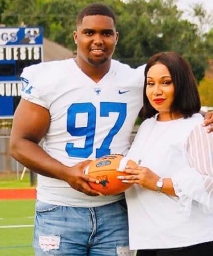 Taylor High senior defensive lineman Treviance Bronson is pictured with his mother, Victoria.